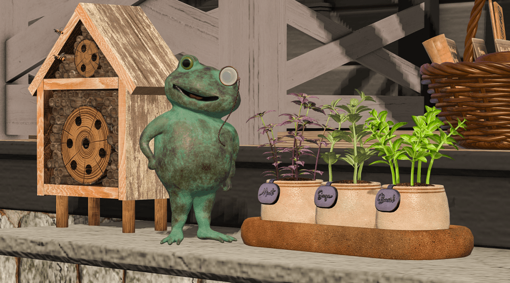 A whimsical garden scene in Second Life featuring a rustic wooden bee hotel with two bees hovering near the entrance, a cheerful green frog statue wearing a monocle, and three small herb planters labeled Mint, Sage, and Basil. The items are arranged on a wooden surface alongside a wicker basket in the background, creating a cozy, spring-themed display.